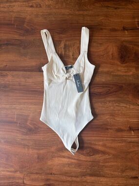 Lulu's Cream Ribbed Tie-Front Bodysuit